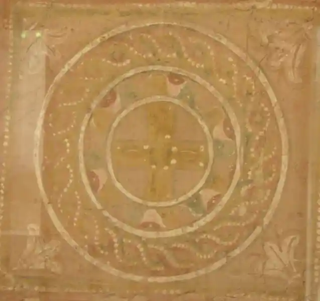 Cross inside circle with twists around